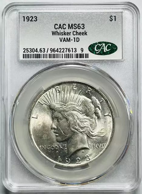 1923 Peace Silver Dollar CACG MS 63 VAM-1D: 1923 Peace Silver Dollar CACG MS 63 VAM-1D This is a 1923 Peace Dollar graded MS 63 by CACG, featuring the Whisker Cheek VAM-1D variety. The coin is composed of silver and has been certified by CAC. I