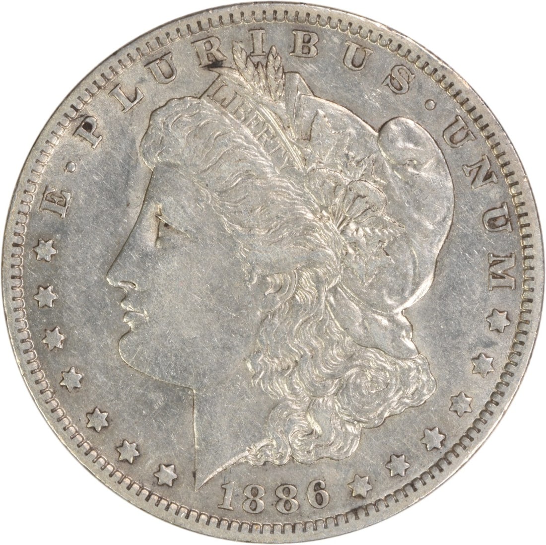 1886-O Morgan Silver Dollar EF Uncertified 90% Silver Coin: 1886-O Morgan Silver Dollar EF Uncertified 90% Silver Coin This 1886-O Morgan Silver Dollar features a classic design by George T. Morgan, embodying the rich history of American coinage. Struck at the