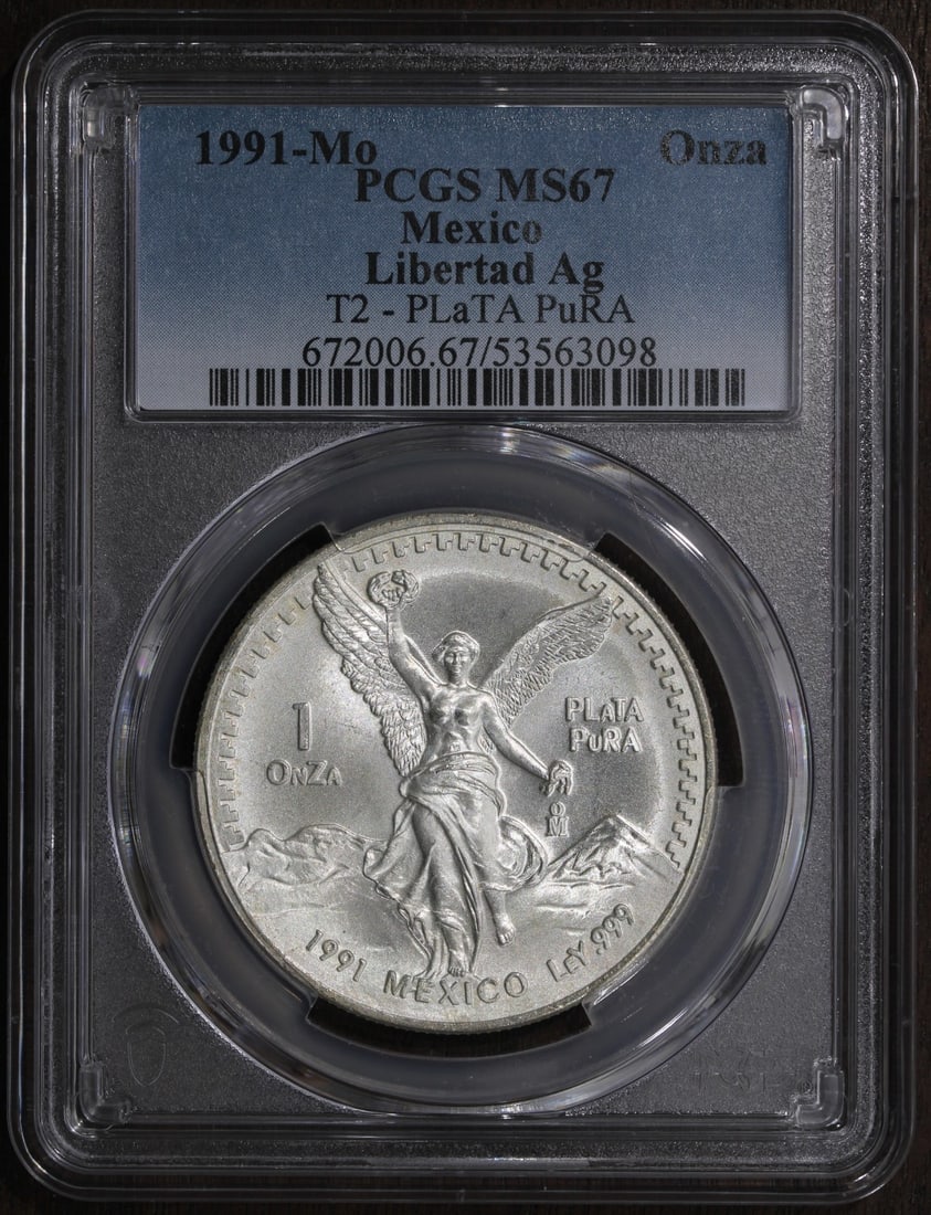 PCGS MS67 1991-Mo Mexico Silver Libertad 1 oz Type 2 Key Date: PCGS MS67 1991-Mo Mexico Silver Libertad 1 oz Type 2 Key Date This is a 1991 Mexican Libertad 1 oz silver coin, graded MS67 by PCGS. The coin is composed of .999 fine silver and was minted by the Mexi