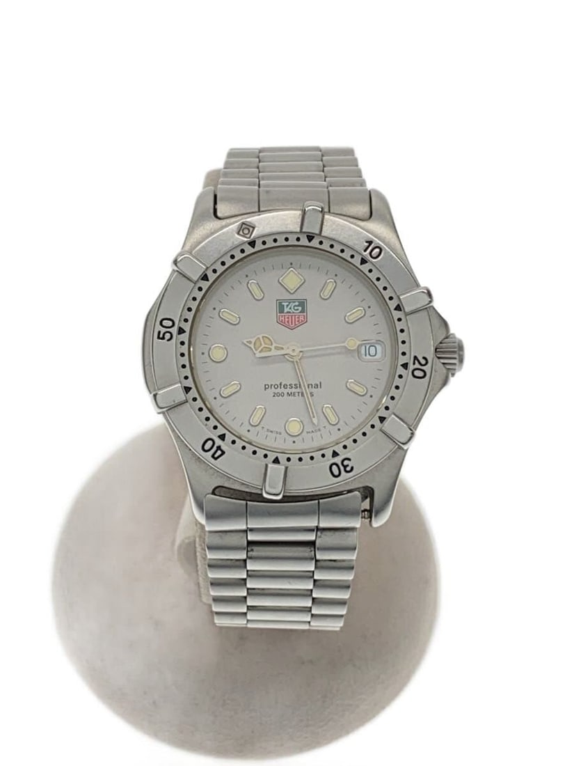 TAG Heuer WE1211-R Stainless Steel Quartz Wristwatch: TAG Heuer WE1211-R Stainless Steel Quartz Wristwatch This TAG Heuer Professional Quartz WE1211-R men's wristwatch features a stainless steel case and band with a white dial. Designed for men, it showc