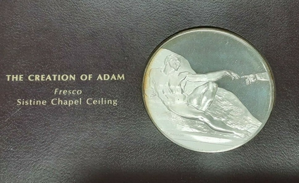 Franklin Mint Creation of Adam .925 Silver Proof Medal: Franklin Mint Creation of Adam .925 Silver Proof Medal Proof Franklin Mint medal from the 1970 Genius of Michelangelo series featuring The Creation of Adam from Michelangelo's Sistine Chapel frescoes.
