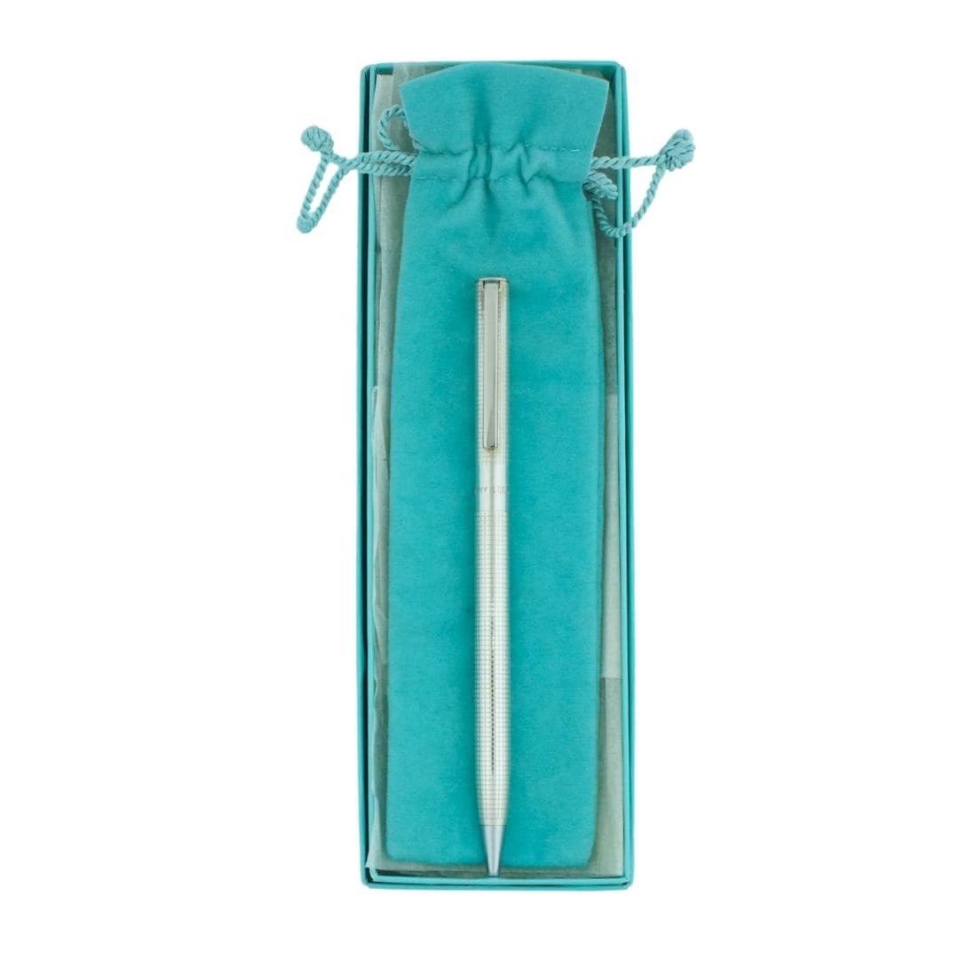 Tiffany & Co. Machined Sterling Silver Ballpoint Pen with Box: Tiffany & Co. Machined Sterling Silver Ballpoint Pen with Box Classic Tiffany & Co. ballpoint pen in sterling silver with a finely machined design. The pen is stamped Tiffany & Co. and Sterling .925, 
