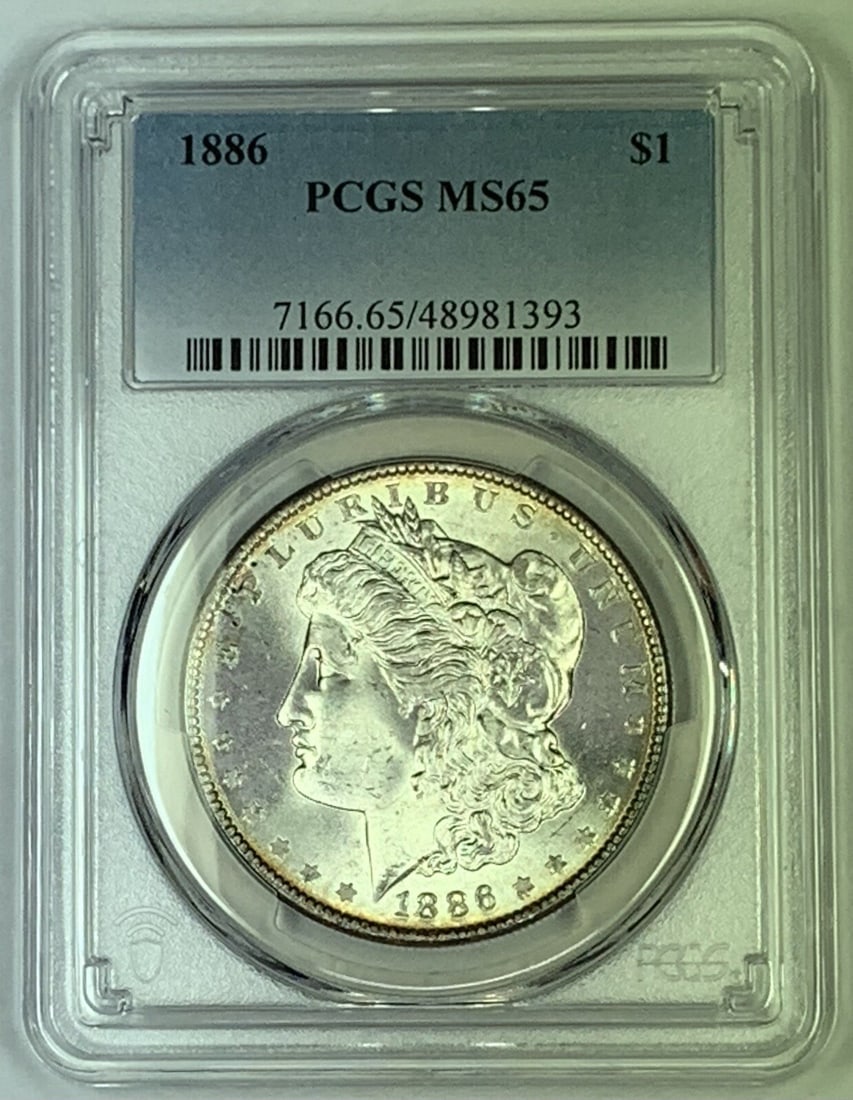 1886 Morgan Dollar Silver Coin PCGS MS 65 Certified Uncirculated: 1886 Morgan Dollar Silver Coin PCGS MS 65 Certified Uncirculated This 1886 Morgan Silver Dollar is graded MS 65 by PCGS, indicating a high-quality uncirculated condition. The coin is composed of silve
