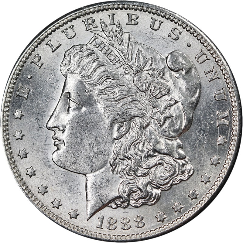 1888-S Morgan Dollar Uncirculated Silver Bright White: 1888-S Morgan Dollar Uncirculated Silver Bright White This 1888-S Morgan Silver Dollar is an uncirculated coin featuring bright white color, attractive luster, and a well-defined strike. The coin disp