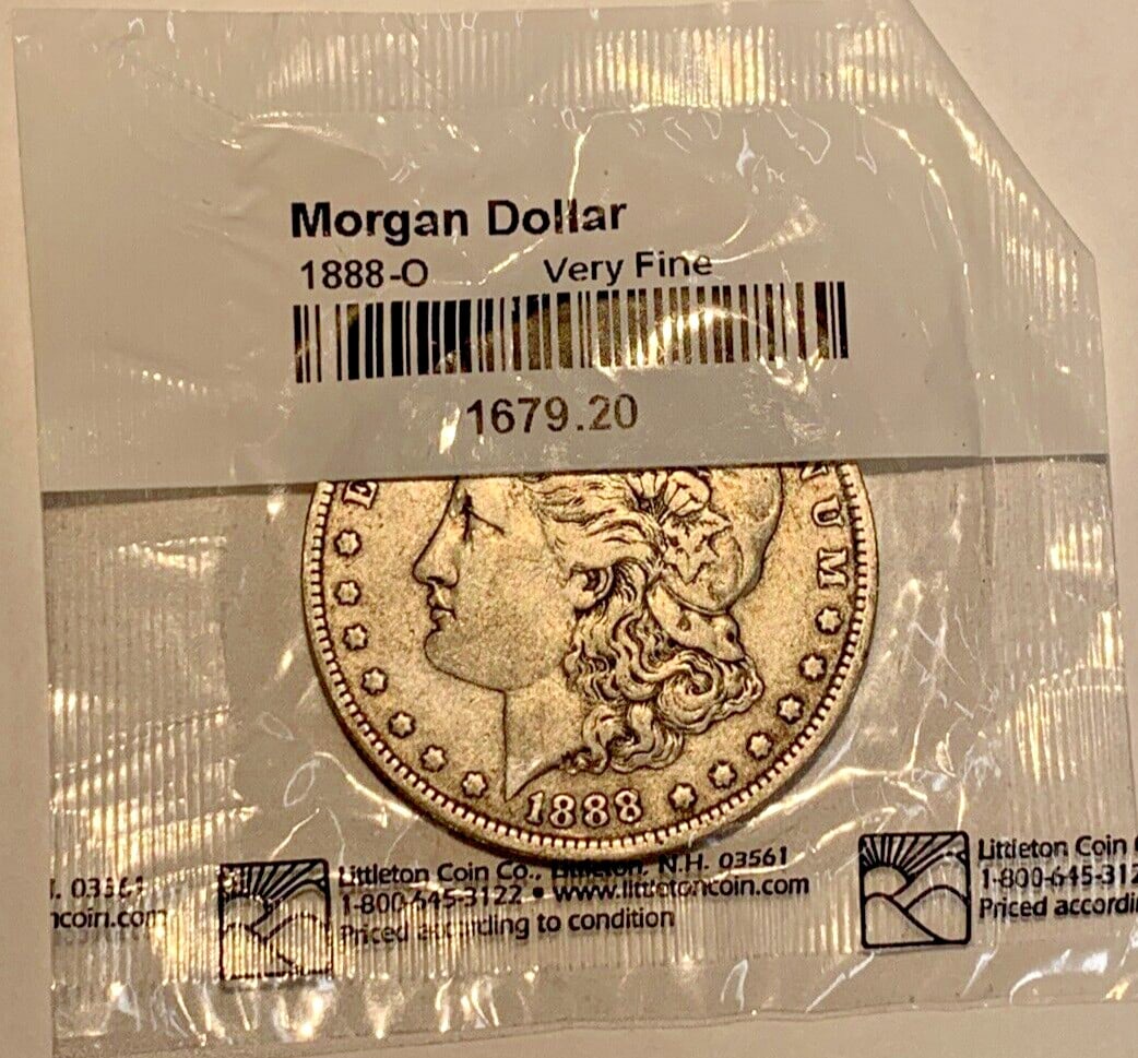 Morgan Silver Dollar 1888-O New Orleans Mint Very Fine Littleton Issue: Morgan Silver Dollar 1888-O New Orleans Mint Very Fine Littleton Issue This is an 1888-O Morgan Silver Dollar from the United States, minted in New Orleans. The coin is composed of silver and has a de