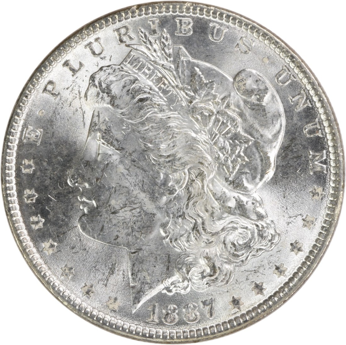 Brilliant Uncirculated 1887 Silver Dollar Morgan Uncertified No Mint Mark: Brilliant Uncirculated 1887 Silver Dollar Morgan Uncertified No Mint Mark This 1887 Morgan Silver Dollar is an uncirculated coin with brilliant uncirculated (BU) grade. It is composed of silver and do