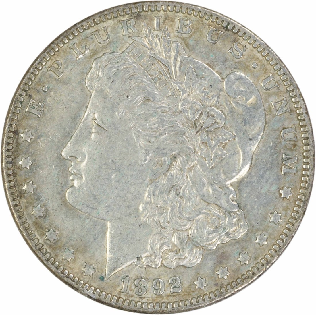 AU 1892 O Morgan Silver Dollar $1 Uncertified: AU 1892 O Morgan Silver Dollar $1 Uncertified An 1892-O Morgan silver dollar in AU grade, offered as an uncertified circulated coin. It features the classic Morgan design by George T. Morgan and is id