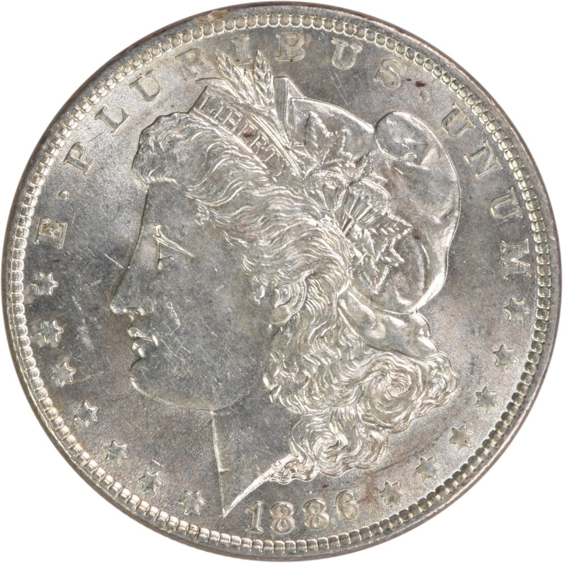 Uncirculated 1886 Morgan Dollar Silver Choice BU Philadelphia No Mint Mark: Uncirculated 1886 Morgan Dollar Silver Choice BU Philadelphia No Mint Mark This 1886 Morgan Silver Dollar is a Choice Brilliant Uncirculated coin, uncertified and pre-owned. It features no mint mark a