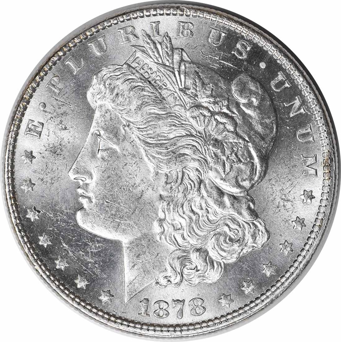 Choice BU 1878 Morgan Dollar 7 Tail Feathers Reverse of 1879 Uncertified Silver Coin: Choice BU 1878 Morgan Dollar 7 Tail Feathers Reverse of 1879 Uncertified Silver Coin This is an uncirculated 1878 Morgan Silver Dollar featuring the 7 tail feathers reverse of 1879. The coin is compos