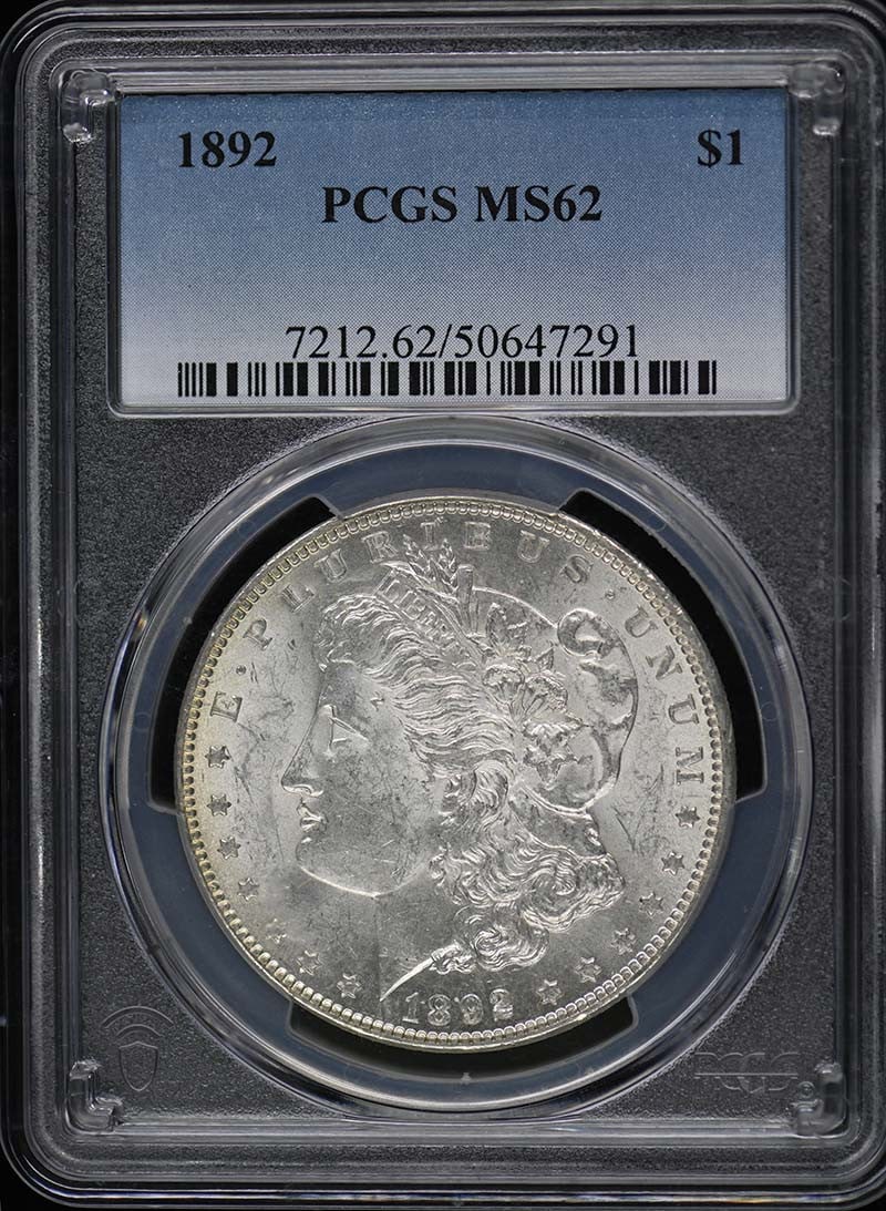 1892 Morgan Dollar PCGS MS62 Uncirculated Philadelphia Coin: 1892 Morgan Dollar PCGS MS62 Uncirculated Philadelphia Coin This is a stunning 1892 Morgan Dollar, graded MS62 by PCGS, showcasing its uncirculated condition. Minted in Philadelphia, this iconic coin 