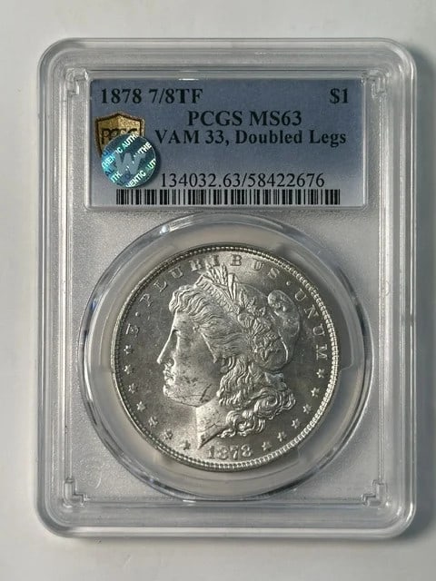 PCGS MS-63 1878 P Morgan Silver Dollar VAM 33 7TF: PCGS MS-63 1878 P Morgan Silver Dollar VAM 33 7TF 1878 Morgan Dollar certified by PCGS and graded MS-63. This silver dollar is identified as the 7TF Rev 1878 VAM 33 variety with doubled legs and a sig