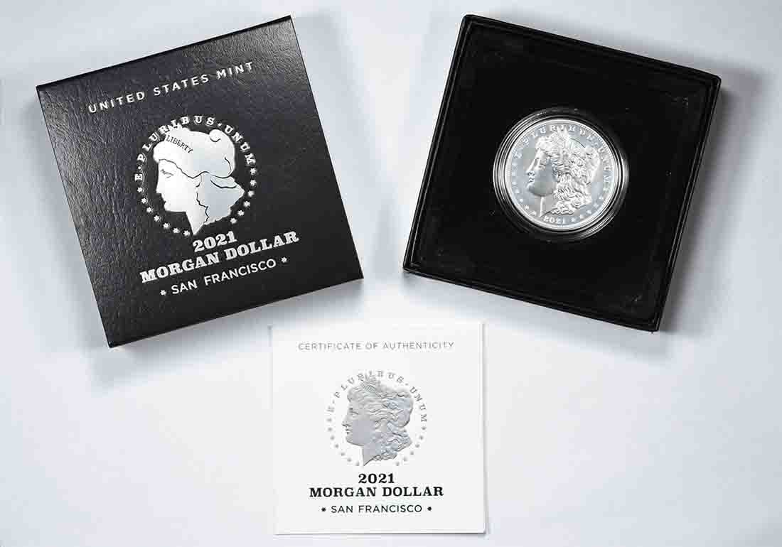 Original Government Packaging 2021-S Morgan $1 Silver Coin: Original Government Packaging 2021-S Morgan $1 Silver Coin 2021-S Morgan Silver Dollar presented in original government packaging. This pre-owned coin is an uncertified uncirculated issue struck in 99