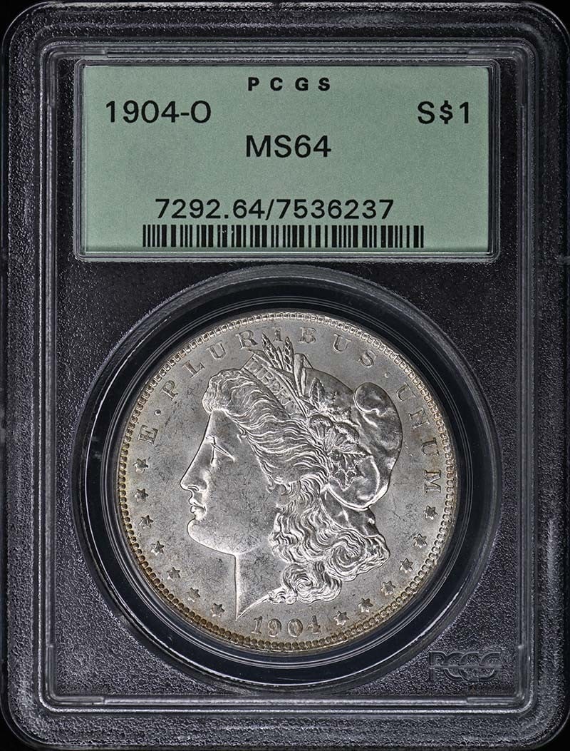PCGS MS64 1904 O Morgan Silver Dollar: PCGS MS64 1904 O Morgan Silver Dollar 1904-O Morgan Dollar certified by PCGS and graded MS64. This uncirculated United States silver dollar is a pre-owned coin from the Morgan Dollar series. Specifica