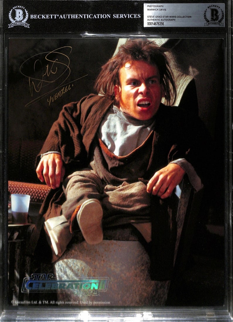 Warwick Davis Autographed 8x10 Photo as Weazel Beckett Authenticated Star Wars: Warwick Davis Autographed 8x10 Photo as Weazel Beckett Authenticated Star Wars This is an original 8x10 photograph from Star Wars: The Phantom Menace, officially released for Star Wars Celebration II.
