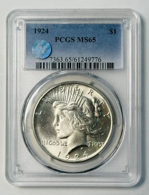 PCGS MS-65 1924 Peace Dollar Silver $1 Sight White: PCGS MS-65 1924 Peace Dollar Silver $1 Sight White 1924 Peace Dollar certified by PCGS and graded MS 65. This silver dollar is described as Sight White and is a pre-owned coin. Specifications Coin Typ
