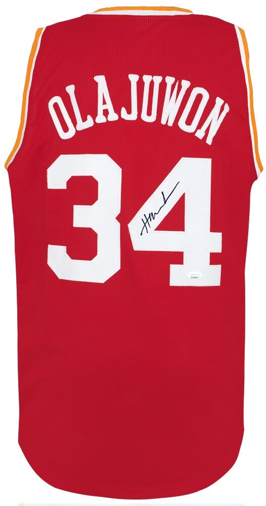 Hakeem Olajuwon Signed Red 'The Dream' Jersey JSA COA: Hakeem Olajuwon Signed Red 'The Dream' Jersey JSA COA Celebrate the legacy of basketball legend Hakeem Olajuwon with this signed red throwback custom basketball jersey. Featuring 'The Dream' and his i