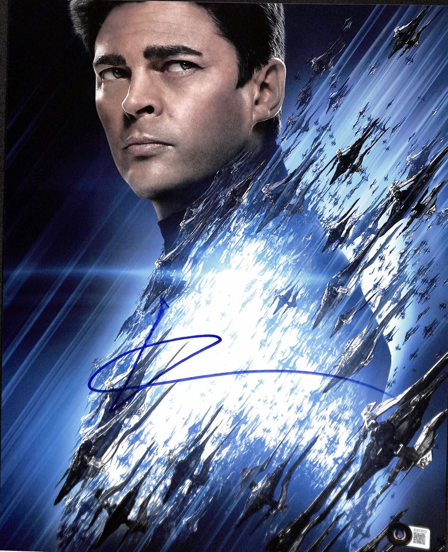 Karl Urban Signed 11x14 Star Trek Photograph Beckett Certified: Karl Urban Signed 11x14 Star Trek Photograph Beckett Certified This stunning 11x14 photograph features Karl Urban as "Bones" from the Star Trek movie franchise, signed in blue permanent marker. The si