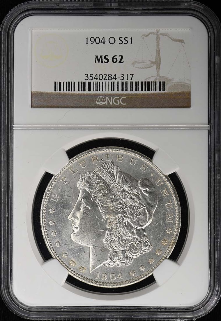NGC MS62 1904 O Morgan Silver Dollar S$1: NGC MS62 1904 O Morgan Silver Dollar S$1 Certified 1904-O Morgan Dollar with an NGC MS62 grade. This uncirculated United States silver dollar is a pre-owned example of the Morgan Dollar series. Specif