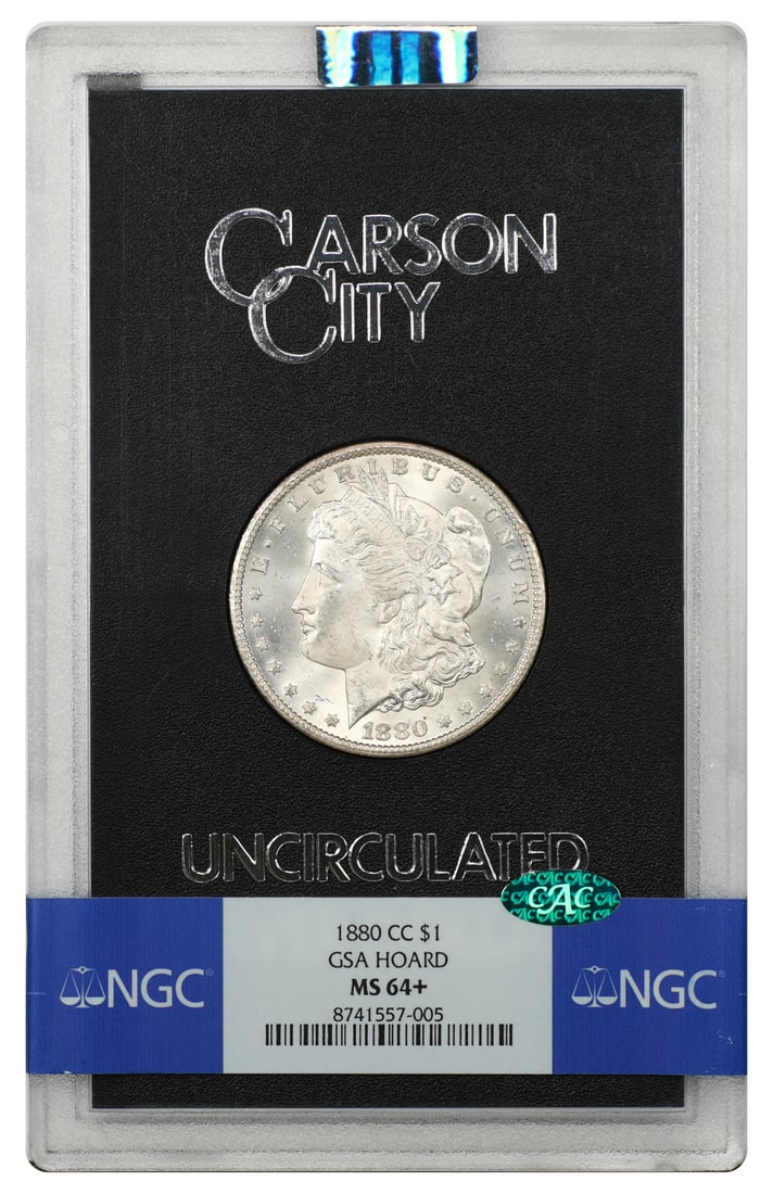 1880-CC Morgan Dollar $1 GSA NGC MS64+ CAC: 1880-CC Morgan Dollar $1 GSA NGC MS64+ CAC 1880-CC Morgan Dollar in original GSA hard case, graded NGC MS64+ and endorsed by CAC. This uncirculated example is a Carson City Mint issue and remains a po
