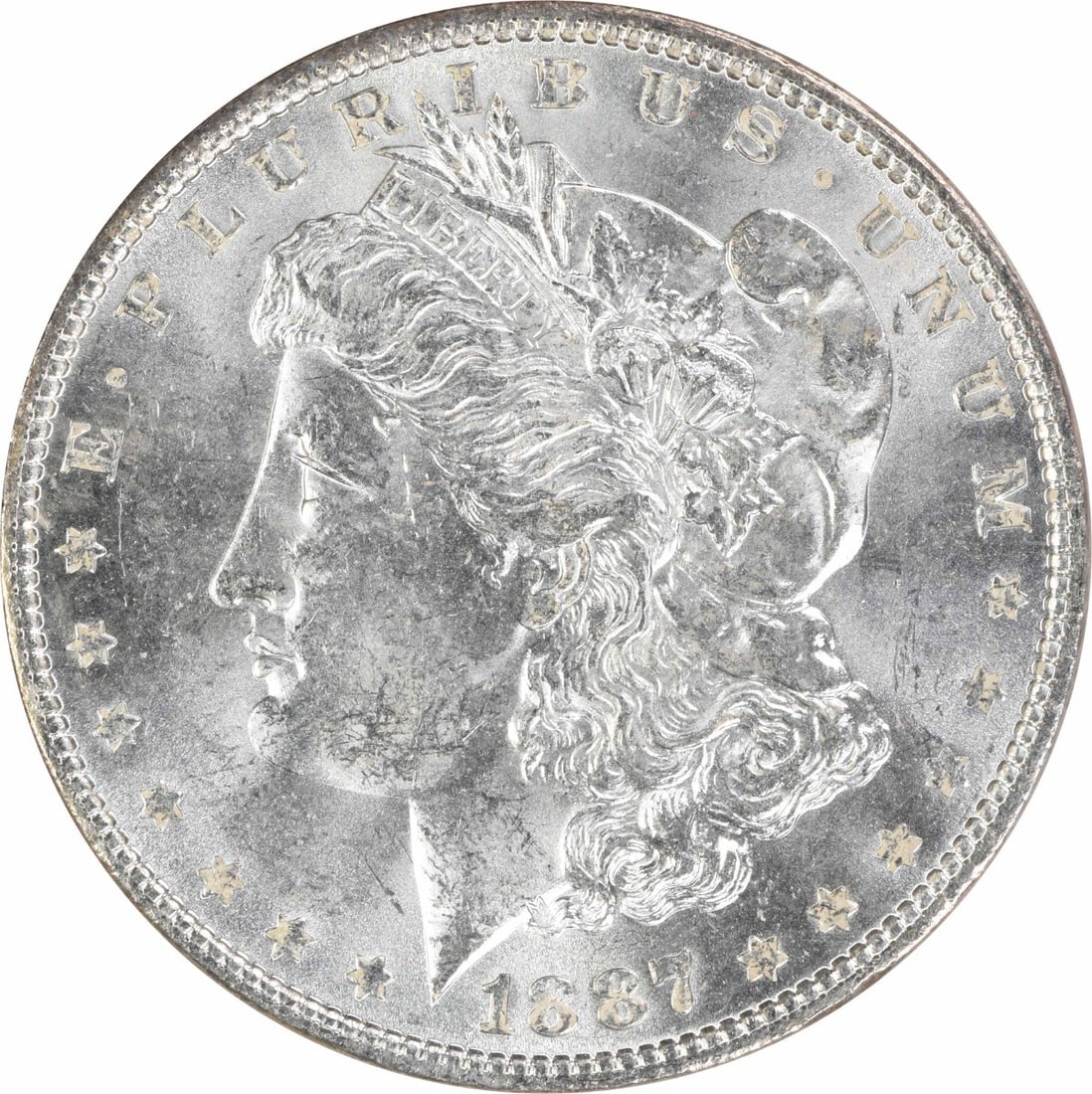 1887 Uncirculated Morgan $1 Silver Coin Uncertified: 1887 Uncirculated Morgan $1 Silver Coin Uncertified 1887 Morgan Silver Dollar in uncirculated, uncertified condition. This pre-owned United States $1 coin is composed of silver and is identified as KM