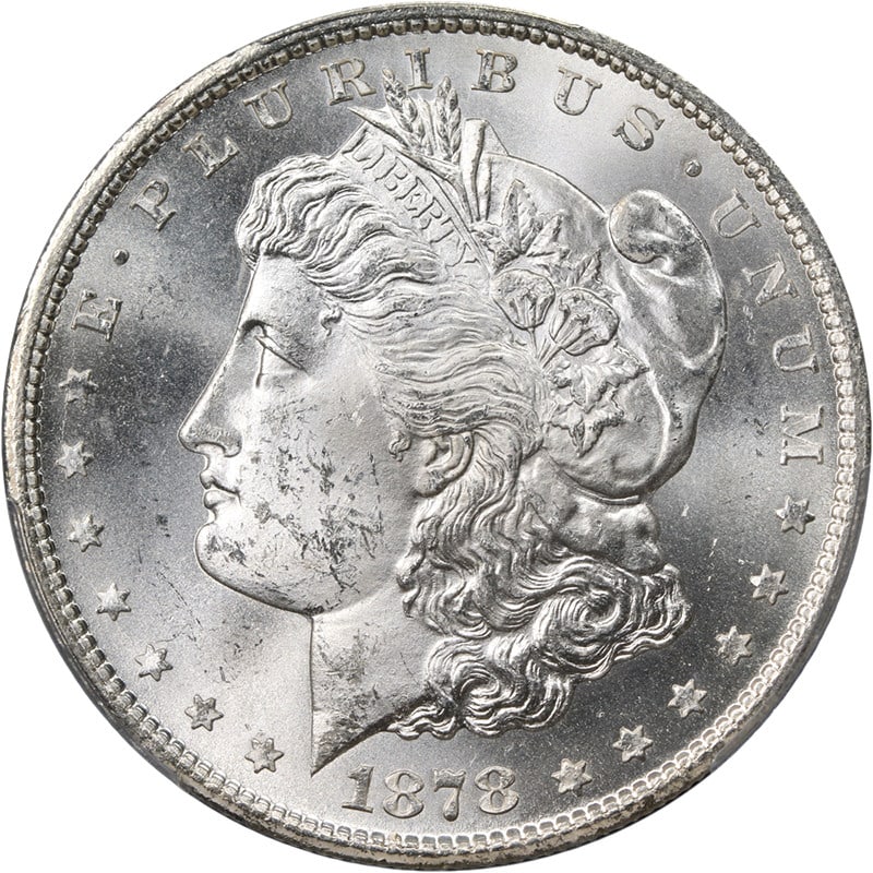 PCGS MS63 1878 CC Morgan Silver Dollar Blast White Uncirculated: PCGS MS63 1878 CC Morgan Silver Dollar Blast White Uncirculated An 1878-CC Morgan Silver Dollar graded PCGS MS63. This pre-owned coin is described as uncirculated, blast white, and wonderfully origina