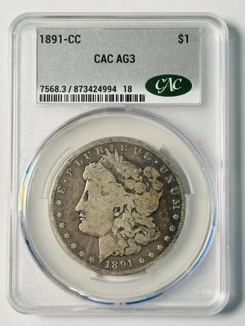 1891 Carson City Morgan Silver Dollar CAC AG 03: 1891 Carson City Morgan Silver Dollar CAC AG 03 Pre-owned 1891-CC Morgan Silver Dollar graded AG 03 and certified by CACG. This Carson City issue is composed of silver and carries the 1891-CC denomina