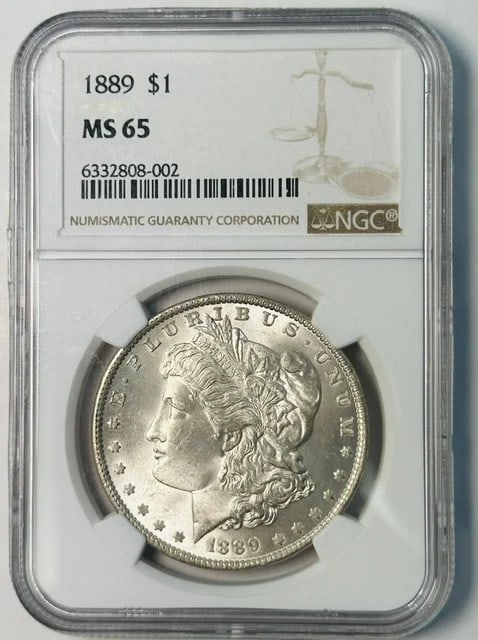NGC MS-65 1889 Morgan Silver Dollar White: NGC MS-65 1889 Morgan Silver Dollar White 1889 Morgan Silver Dollar certified by NGC and graded MS 65. This pre-owned coin is composed of silver and carries a white designation. Specifications Coin Ty