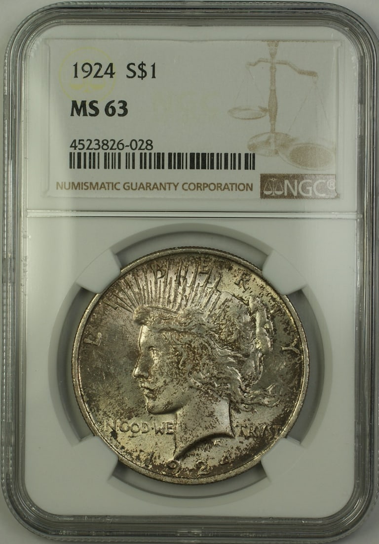 1924 Peace Dollar Silver $1 NGC MS 63 Philadelphia Toned Coin: 1924 Peace Dollar Silver $1 NGC MS 63 Philadelphia Toned Coin This 1924 Silver Peace Dollar is an uncirculated $1 coin graded MS 63 by NGC. Minted in Philadelphia, the coin features a toned finish and