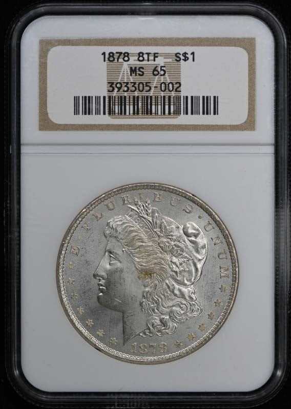 1878 Morgan Silver Dollar 8 Tail Feathers NGC MS65 Uncirculated: 1878 Morgan Silver Dollar 8 Tail Feathers NGC MS65 Uncirculated This is an 1878 8 Tail Feathers Morgan Dollar certified by NGC with a grade of MS65. The coin is uncirculated and was minted in Philadel