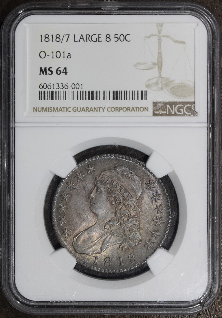 NGC MS64 1818 50C Capped Bust Half Dollar Large 8 O-101A: NGC MS64 1818 50C Capped Bust Half Dollar Large 8 O-101A This 1818/7 Capped Bust Half Dollar features the Large 8, O-101A variety and is graded MS64 by NGC. Struck in silver with a fineness of 0.9, th