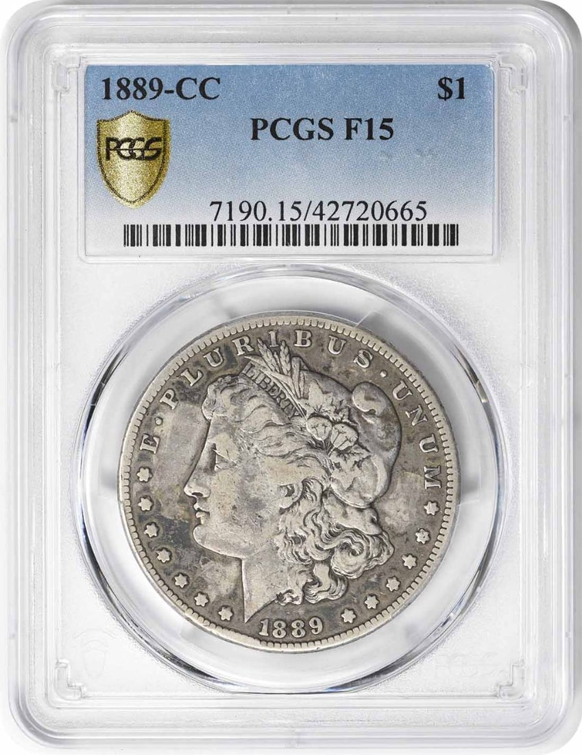 1889-CC Morgan Silver Dollar F Graded PCGS 90% Silver Coin: 1889-CC Morgan Silver Dollar F Graded PCGS 90% Silver Coin This 1889-CC Morgan Silver Dollar, graded F15 by PCGS, is a remarkable piece of numismatic history. Struck in 1889 at the Carson City Mint, t