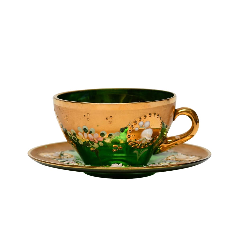 Moser Green Glass Teacup Saucer Floral Gold Trim: Moser Green Glass Teacup Saucer Floral Gold Trim This vintage Bohemian Moser teacup and saucer set is crafted from mouth-blown green glass and features handpainted leaves with a high relief enameled f