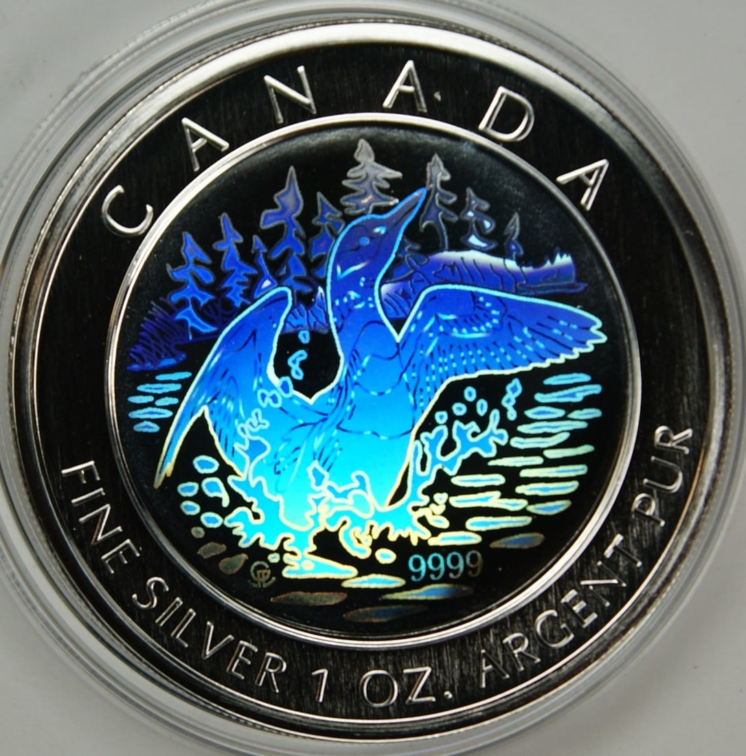 1 oz 2002 Canadian Silver $5 Loon Hologram Coin with Box and COA: 1 oz 2002 Canadian Silver $5 Loon Hologram Coin with Box and COA This un-used 2002 Canada $5 Anniversary Loon coin features a hologram and is struck from 1 oz of 99.99% fine silver. The coin comes wit