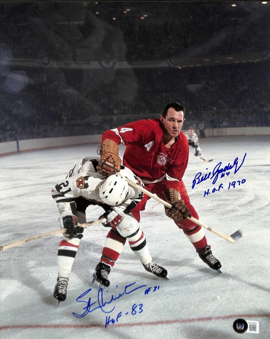 Stan Mikita Bill Gadsby Signed 11x14 Photo Beckett Authenticated HOF: Stan Mikita Bill Gadsby Signed 11x14 Photo Beckett Authenticated HOF This autographed 11x14 photograph features NHL Hall of Famers Stan Mikita and Bill Gadsby, each signing in blue permanent marker. T