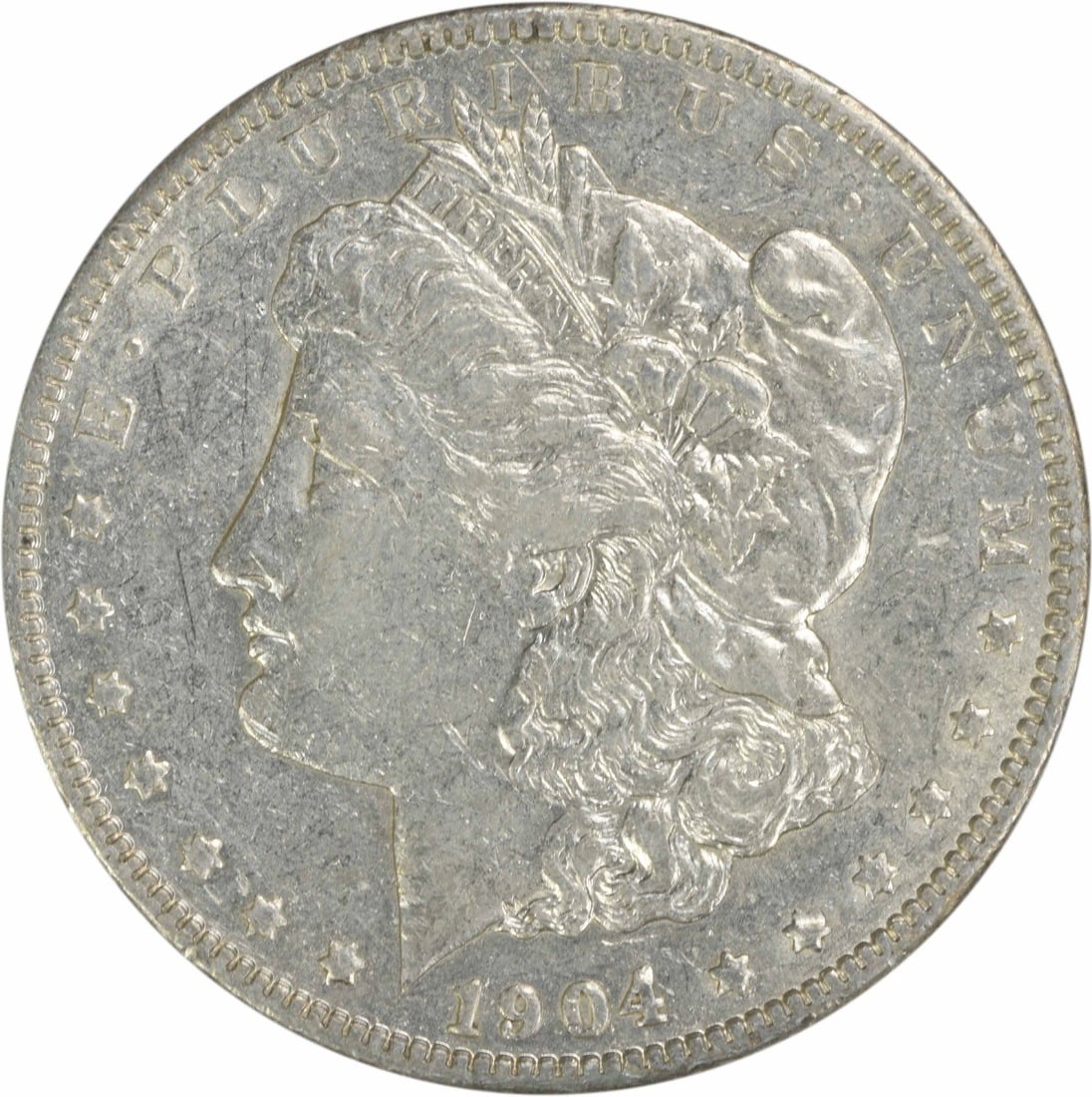 1904 Morgan Silver Dollar EF Uncertified George T. Morgan Design: 1904 Morgan Silver Dollar EF Uncertified George T. Morgan Design This 1904 Morgan Silver Dollar is a classic piece of American numismatics, featuring a stunning design by George T. Morgan. The coin is