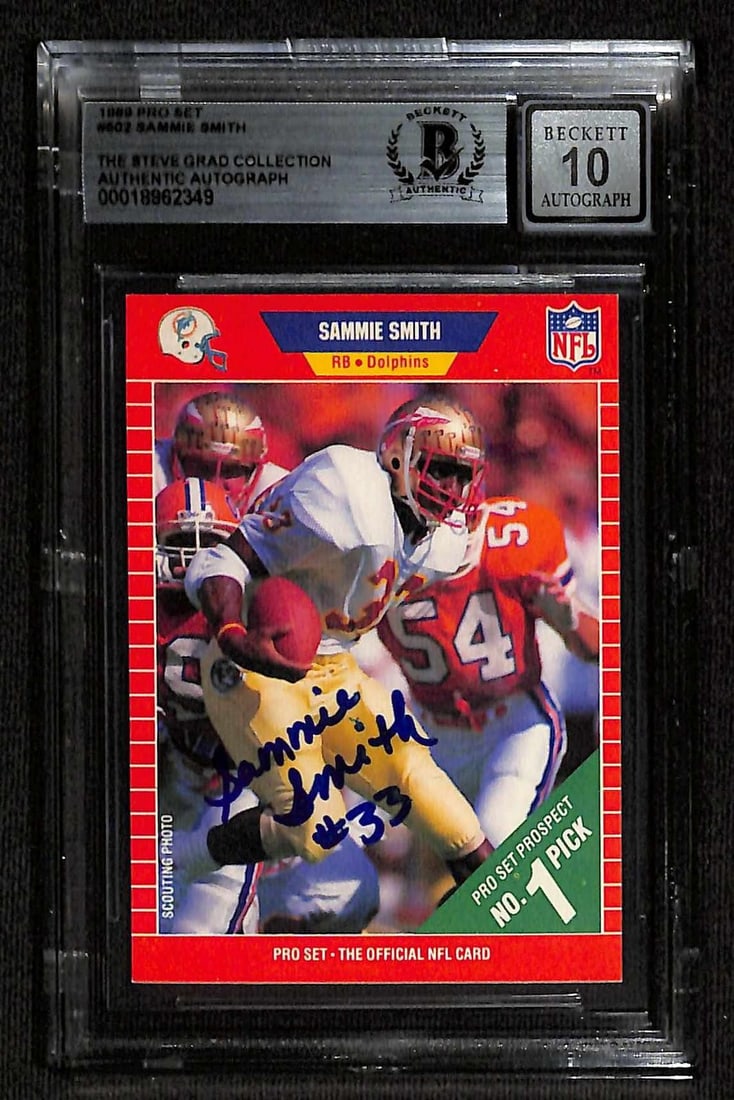 Beckett 10 Autographed 1989 Pro Set Sammie Smith Dolphins Card: Beckett 10 Autographed 1989 Pro Set Sammie Smith Dolphins Card This 1989 Pro Set Miami Dolphins rookie card features running back Sammie Smith and has been hand-signed in bold blue ink with a "#33" in
