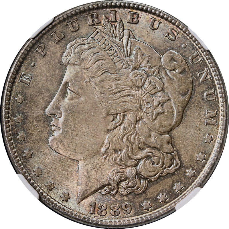 NGC MS63 1889 Morgan Dollar Philadelphia Mint Silver Coin With Dark Toning: NGC MS63 1889 Morgan Dollar Philadelphia Mint Silver Coin With Dark Toning This 1889-P Morgan Silver Dollar is graded MS63 by NGC and features a dark, even toning across the coin. It is an uncirculate