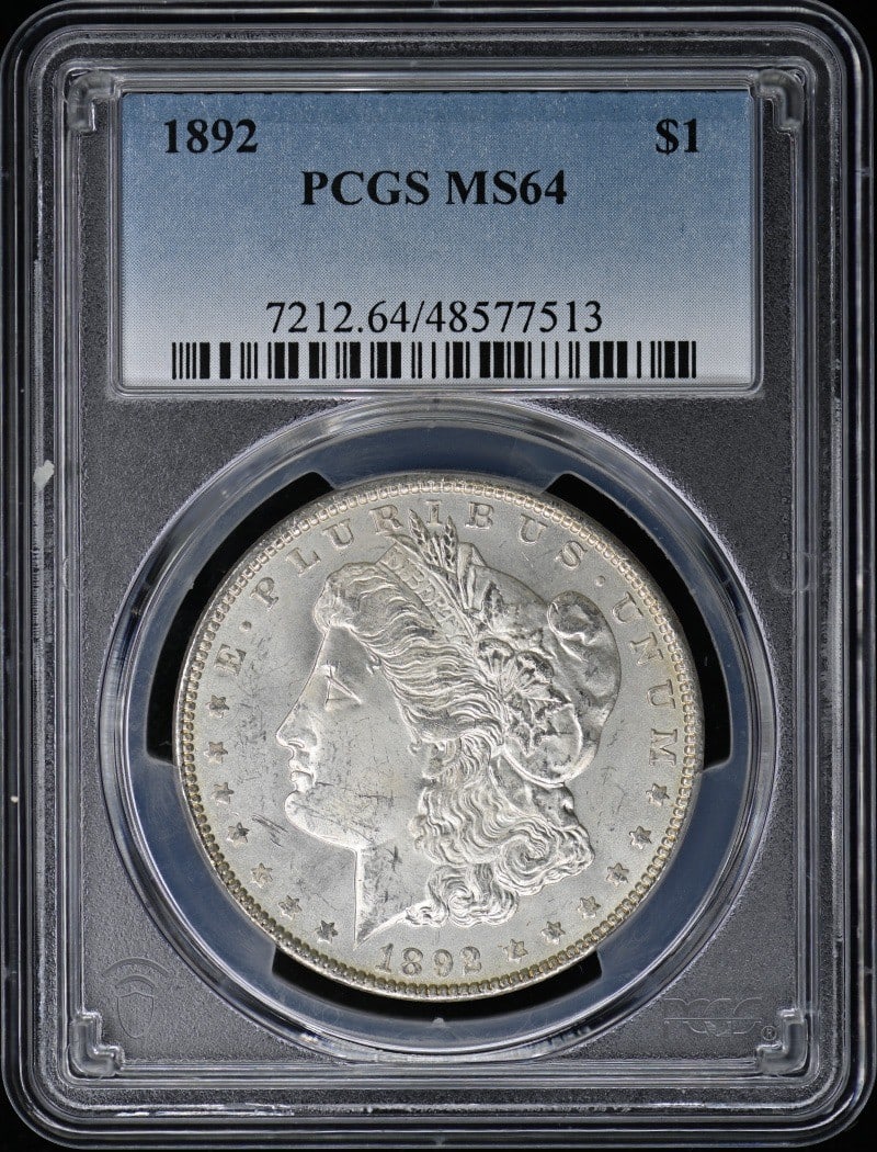 1892 Morgan Dollar PCGS MS64 Uncirculated Philadelphia Mint Coin: 1892 Morgan Dollar PCGS MS64 Uncirculated Philadelphia Mint Coin This 1892 Morgan Dollar is an exceptional addition to any coin collection. Graded MS64 by PCGS, this uncirculated coin showcases the cl
