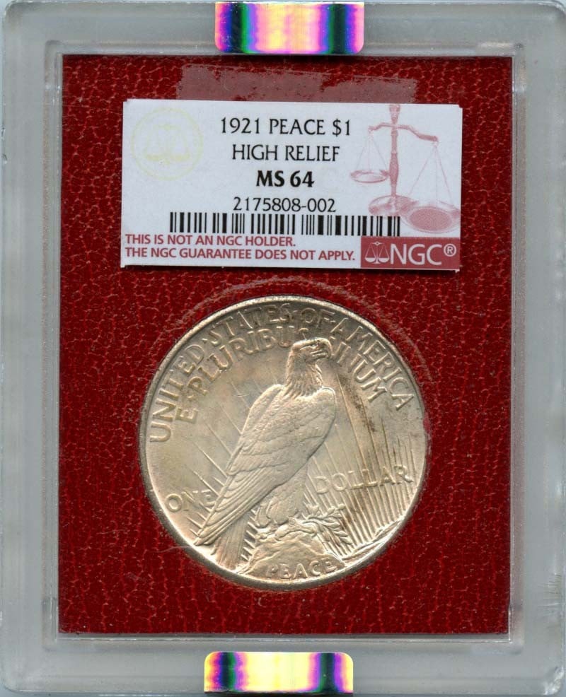 NGC MS64 1921 High Relief Peace Silver Dollar Paramount Holder: NGC MS64 1921 High Relief Peace Silver Dollar Paramount Holder This 1921 Peace Dollar features a high relief design and has been graded MS64 by NGC. Struck in Philadelphia, this uncirculated coin from