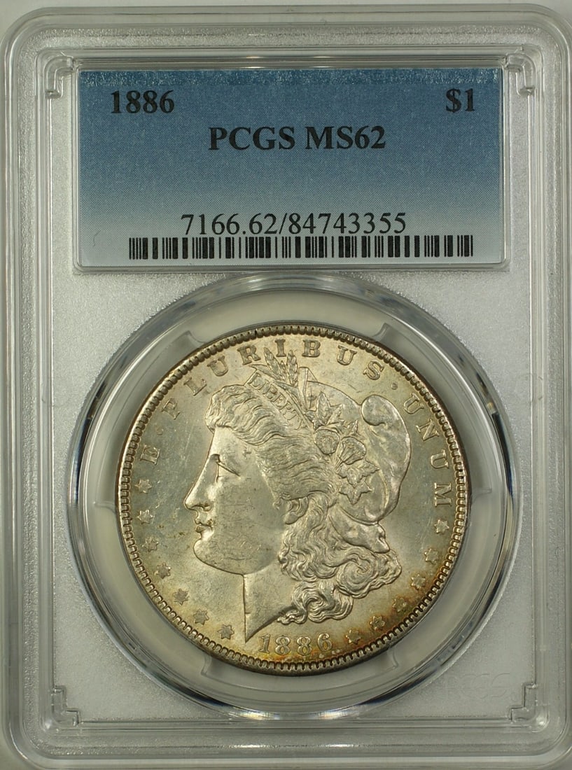 1886 Philadelphia Morgan Dollar PCGS MS62 Silver Light Toning: 1886 Philadelphia Morgan Dollar PCGS MS62 Silver Light Toning This is an 1886 Morgan Silver Dollar graded MS-62 by PCGS. The coin is lightly toned and uncirculated, with its origin from the Philadelph