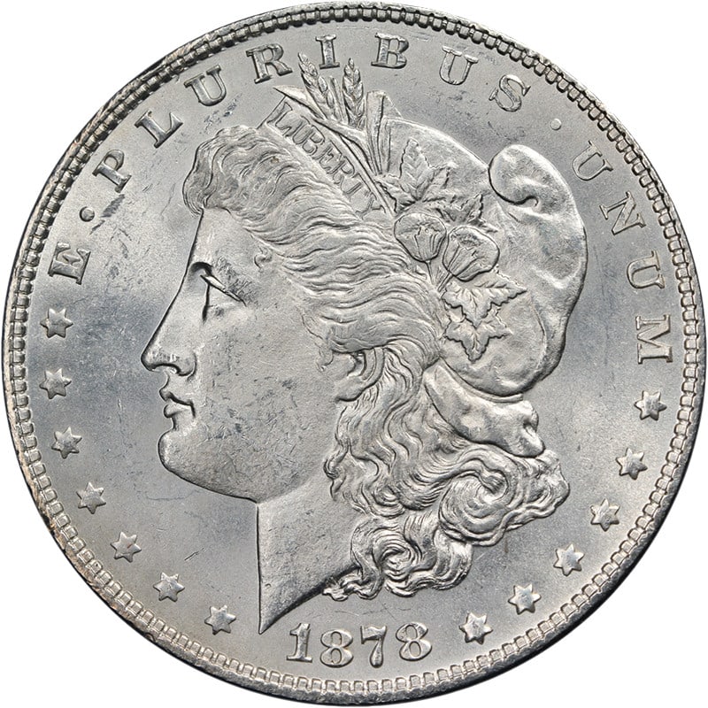 1878 P Morgan Silver Dollar 7TF Choice BU Blast White: 1878 P Morgan Silver Dollar 7TF Choice BU Blast White This is an original 1878-P 7 Tail Feathers Morgan Silver Dollar from the United States. The coin is composed of silver with a fineness of 0.9 and 