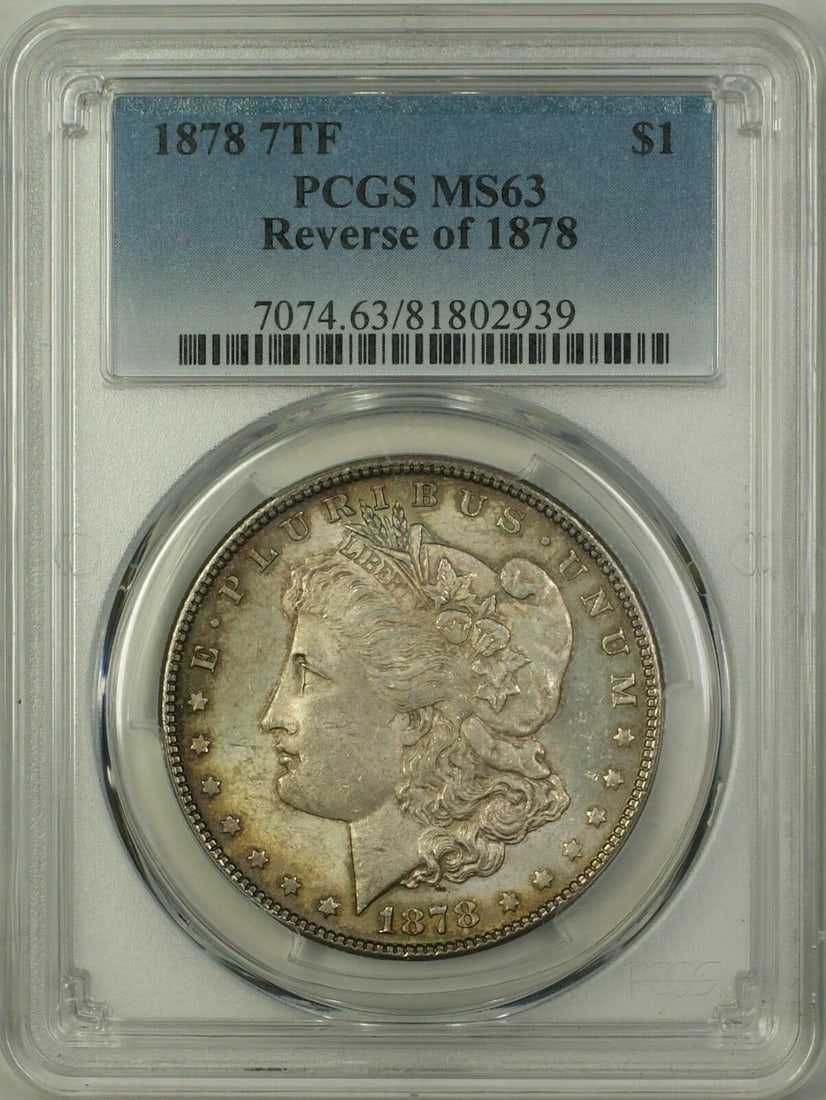 PCGS MS-63 1878 Morgan Dollar 7 Tail Feathers Reverse Silver Coin: PCGS MS-63 1878 Morgan Dollar 7 Tail Feathers Reverse Silver Coin This is a 1878 Morgan Silver Dollar featuring the 7 Tail Feathers Reverse, certified by PCGS with a grade of MS-63. The coin is uncirc