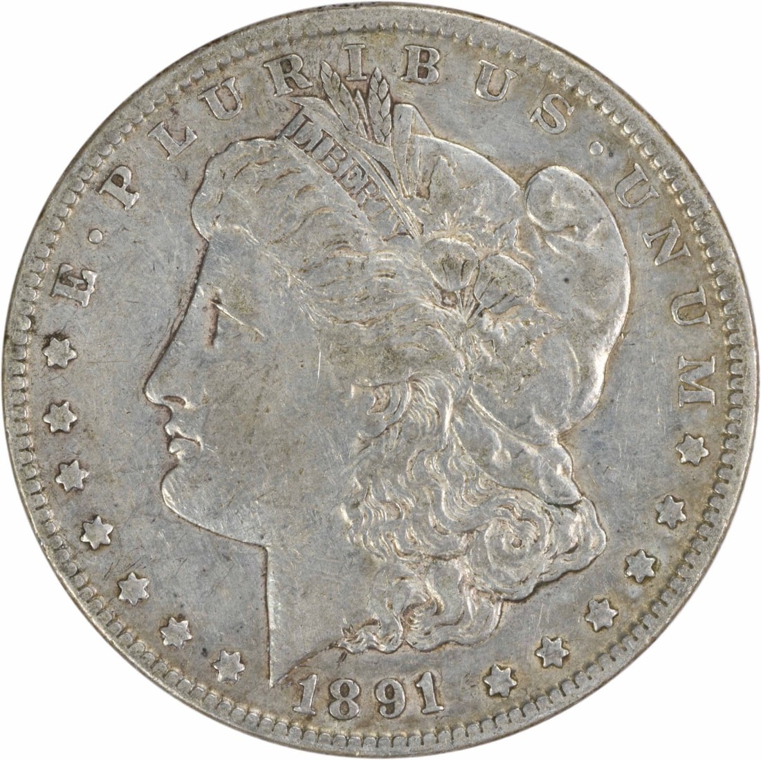 1891-CC Morgan Silver Dollar Uncertified 90% Silver Coin: 1891-CC Morgan Silver Dollar Uncertified 90% Silver Coin This 1891-CC Morgan Silver Dollar is a captivating piece of numismatic history, featuring a striking design by George T. Morgan. The coin is co