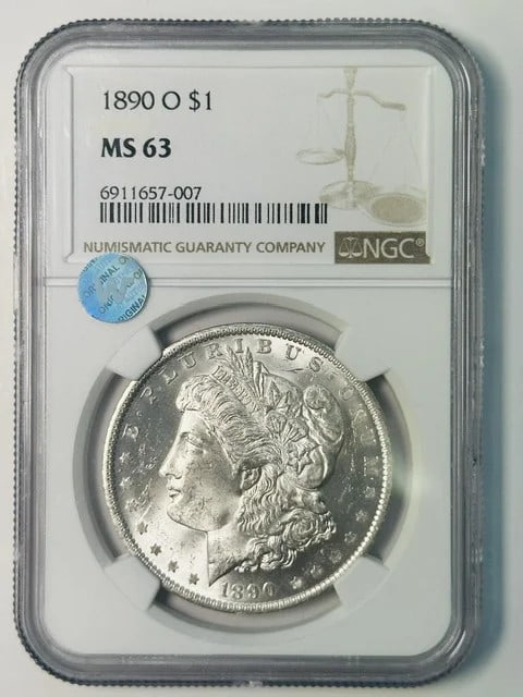 NGC MS-63 1890 O Morgan Silver Dollar Sight White: NGC MS-63 1890 O Morgan Silver Dollar Sight White 1890-O Morgan Silver Dollar certified by NGC and graded MS 63. This pre-owned coin is described as sight white and features silver composition with a 