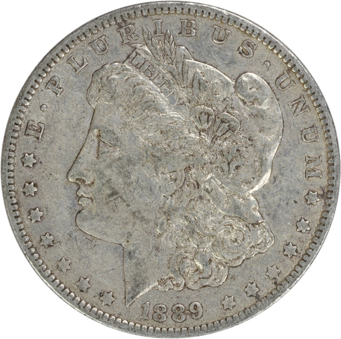 1889-O Morgan Silver Dollar Uncertified 90% Silver Coin: 1889-O Morgan Silver Dollar Uncertified 90% Silver Coin This 1889-O Morgan Silver Dollar is a remarkable piece of numismatic history, featuring a design by George T. Morgan. The coin is circulated, ex