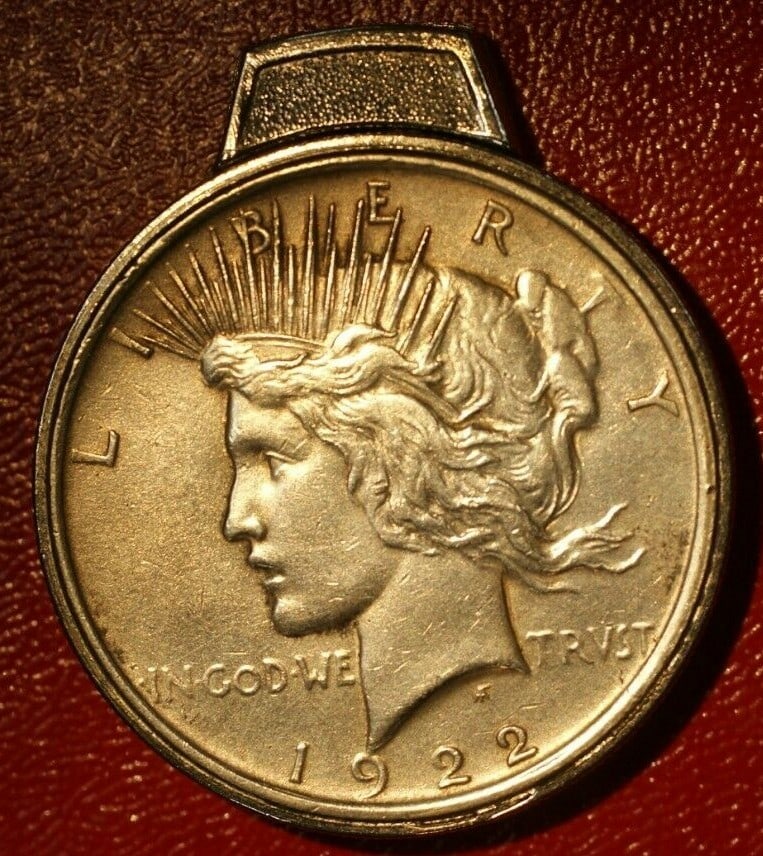 Peace Dollar Lighter Made From Two Silver Coins: Peace Dollar Lighter Made From Two Silver Coins This unique item is a lighter crafted from two genuine 1922 Peace Silver Dollar coins. Originating from the United States, it features the iconic design