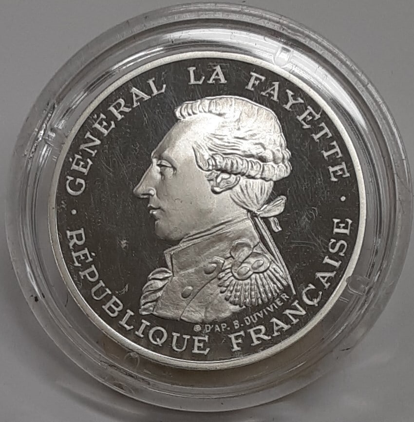 France 1987 Silver 100 Franc Piedfort Coin Honoring General Lafayette BU: France 1987 Silver 100 Franc Piedfort Coin Honoring General Lafayette BU This 1987 100 Franc coin from the Republic of France is a silver Piedfort issue commemorating General Lafayette. Struck in 95% 