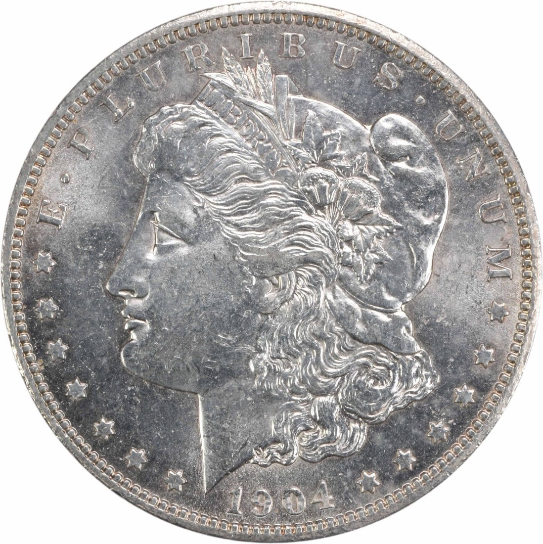 Uncirculated 1904 O Silver Morgan Dollar Brilliant Uncertified US Coin: Uncirculated 1904 O Silver Morgan Dollar Brilliant Uncertified US Coin This is an uncirculated 1904-O Morgan Silver Dollar from the United States. The coin is composed of silver and features the 'O' m