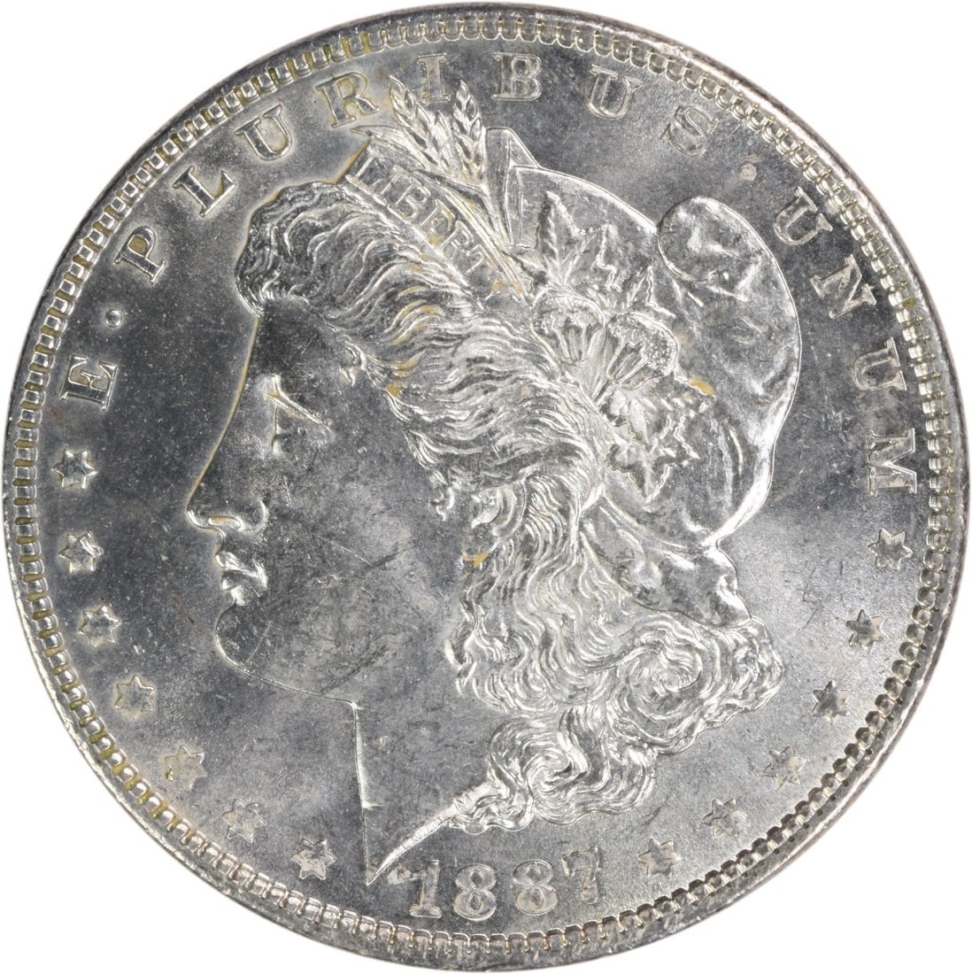 Brilliant Uncirculated 1887 Silver Dollar Morgan Uncertified No Mint Mark: Brilliant Uncirculated 1887 Silver Dollar Morgan Uncertified No Mint Mark This is an uncirculated 1887 Morgan Silver Dollar from the United States. The coin is composed of silver and is in Brilliant U