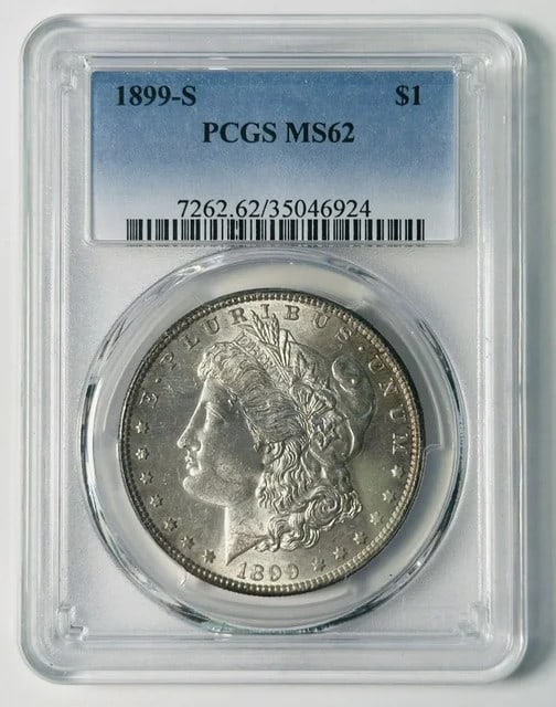 PCGS MS-62 1899-S Morgan Silver Dollar $1: PCGS MS-62 1899-S Morgan Silver Dollar $1 Pre-owned 1899-S Morgan Silver Dollar graded MS-62 by PCGS. This silver one dollar coin was minted in the United States and includes the listed PCGS certifica